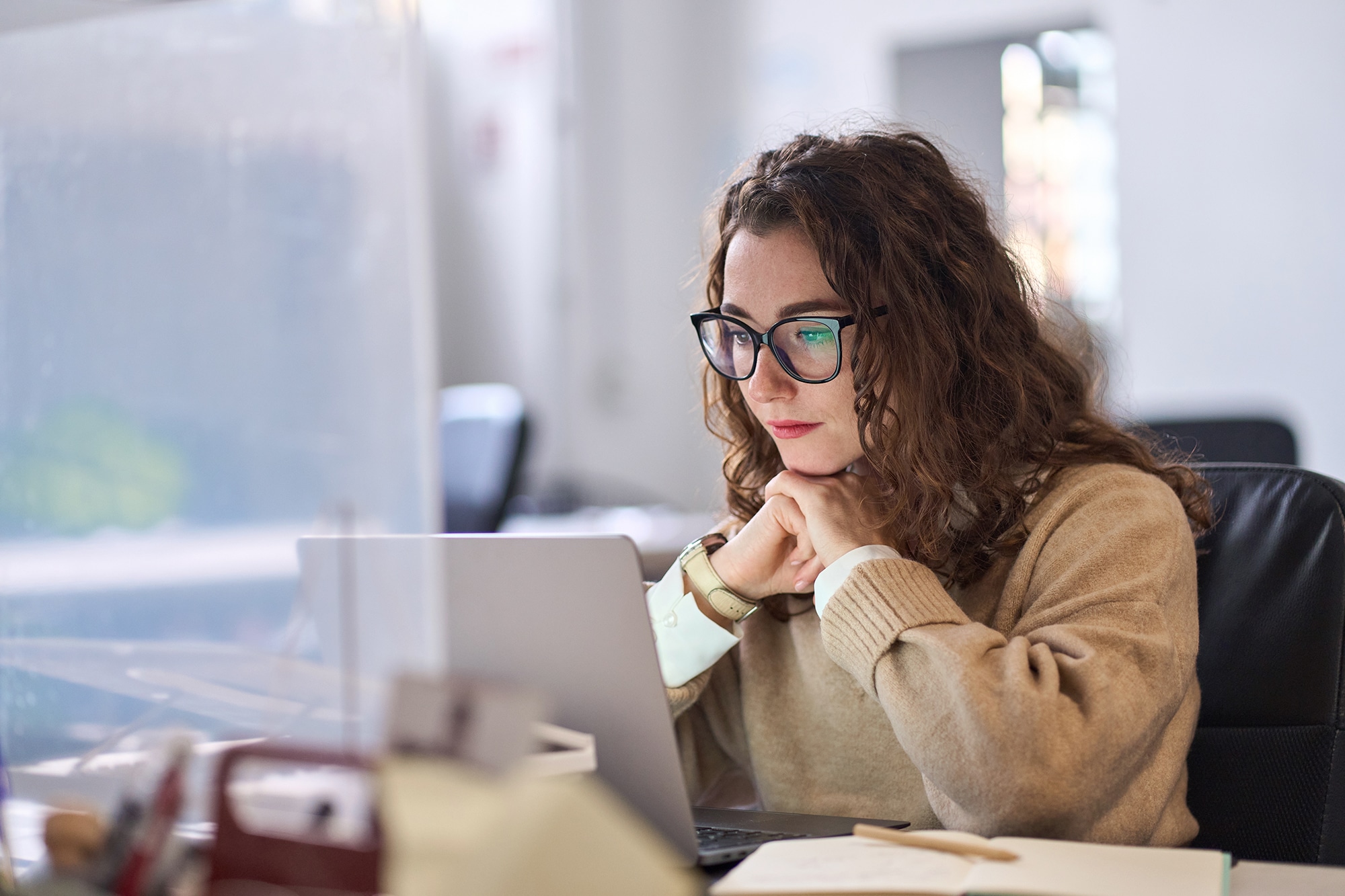 Young serious busy professional business woman employee