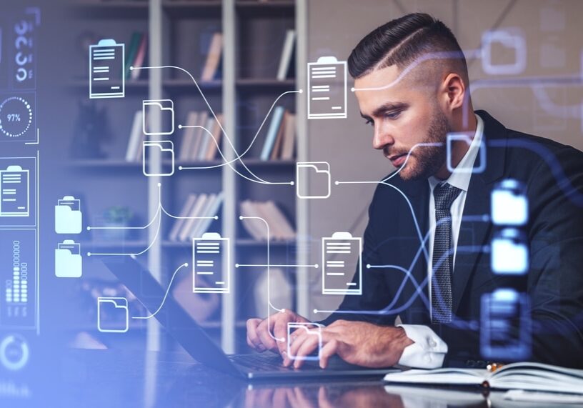 Businessman,Typing,On,Laptop,,Double,Exposure,Online,Documentation,System,And Businessman typing on laptop, double exposure online documentation system and business files storage