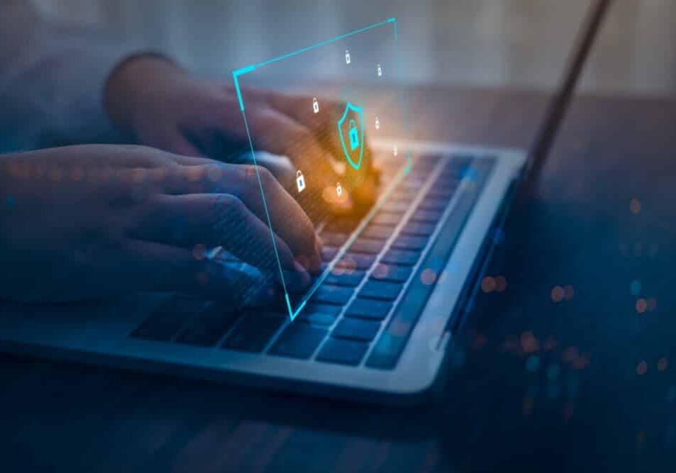 Businessman using a laptop computer with technology cybersecurity and privacy concept
