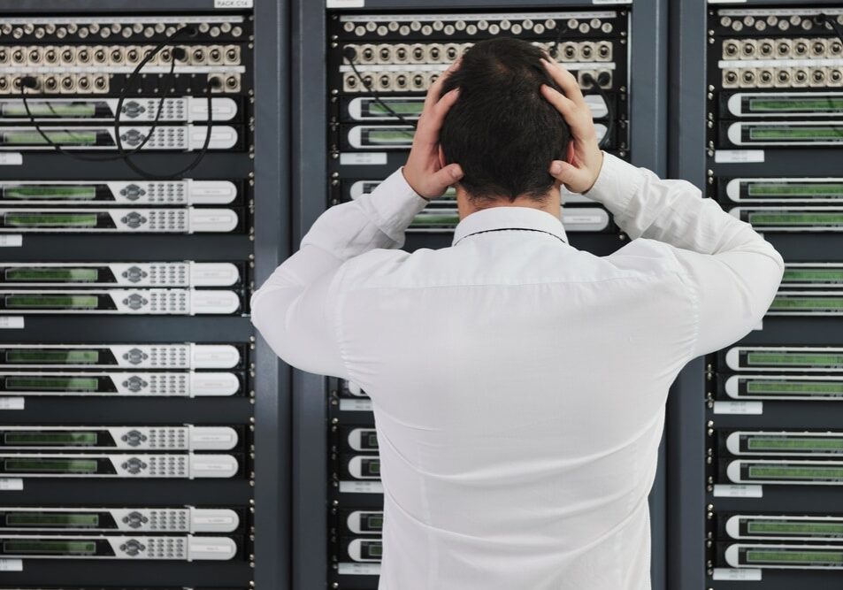 Business,Man,In,Network,Server,Room,Have,Problems,And,Looking business man in network server room have problems and looking for disaster solution