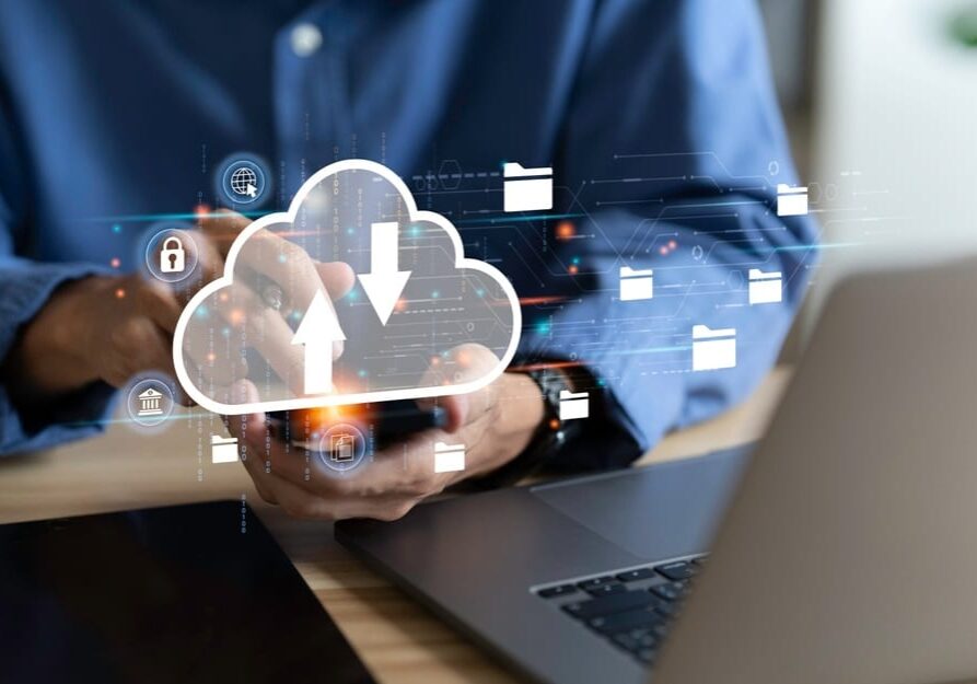 Businessman,Uses,A,Laptop,With,Technology,Cloud,Computing,For,Data Laptop with technology cloud computing for data transmission