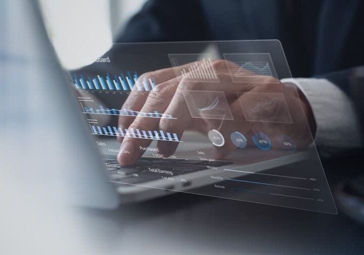 Businessman using laptop computer analyzing sales data and financial growth graph chart report Businessman using laptop computer analyzing sales data and financial growth graph chart report
