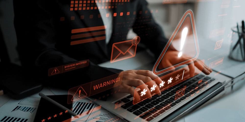 Business professional on laptop with overlaid cybersecurity alerts like 'WARNING!' and 'SYSTEM INFECTED,' illustrating password breach threats and urgency for small business security
