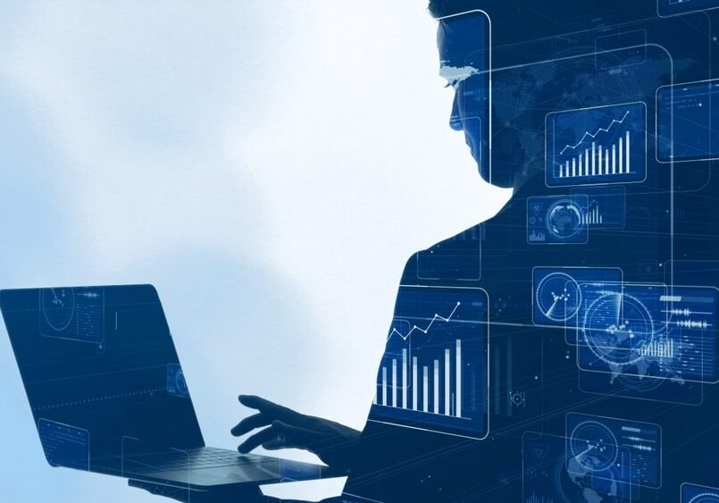 man checking laptop for system data and analysis