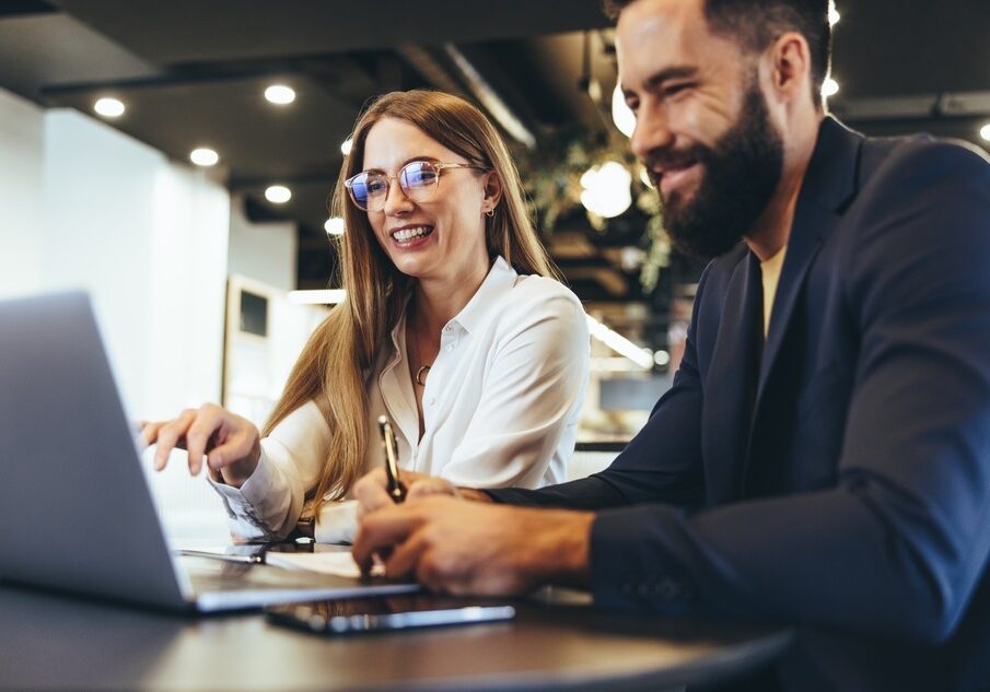 businesspeople using a laptop in an office businesspeople using a laptop in an office